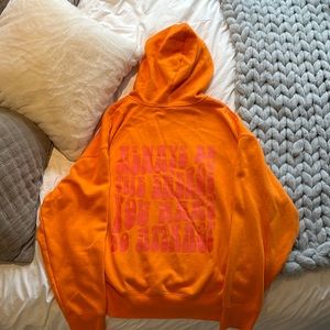 bright orange zip up